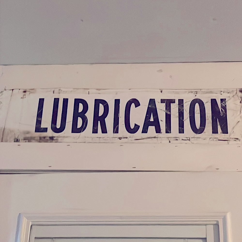 Metal Lubrication sign from repair shop